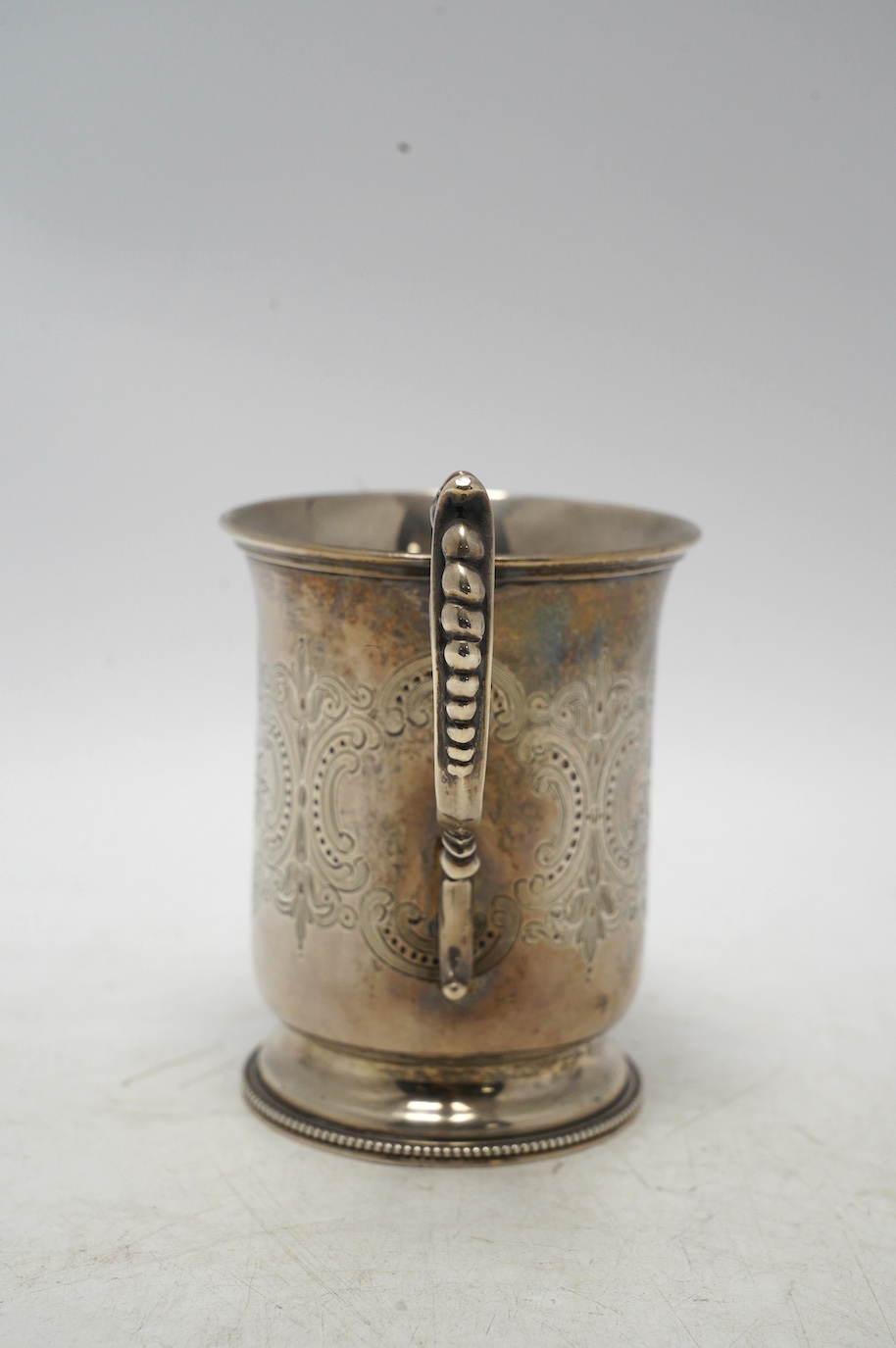 A Victorian engraved silver christening mug, by Edward Charles Brown, London, 1872, 11cm, 5.4oz. Condition - fair to good